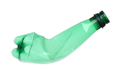 Photo of One crumpled plastic bottle isolated on white