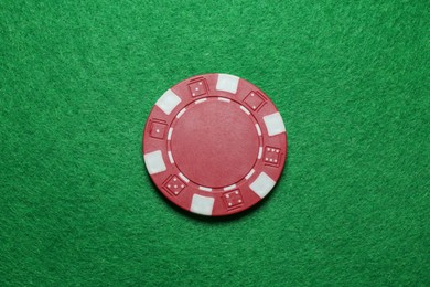 Photo of Poker chip on green table, top view