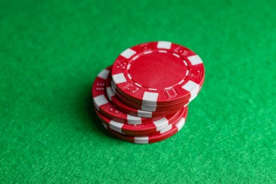 Photo of Poker game. Casino chips on green table