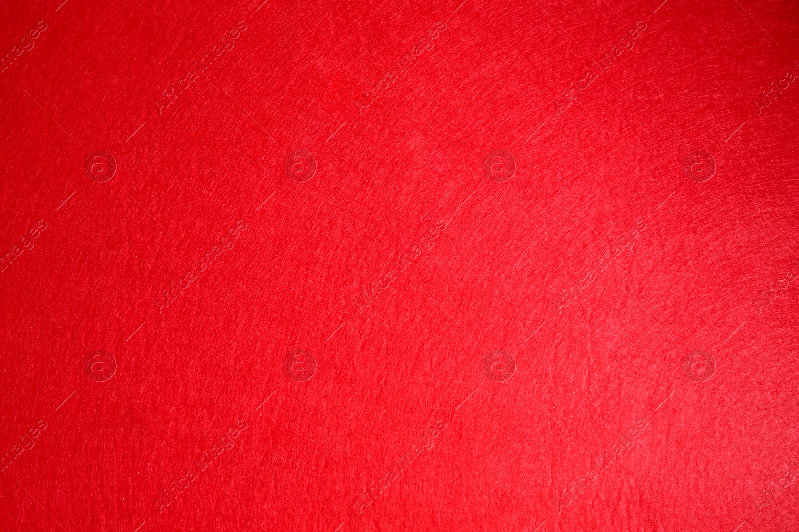 Photo of Red textured surface as background, top view