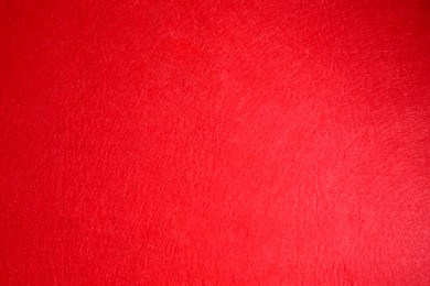 Red textured surface as background, top view