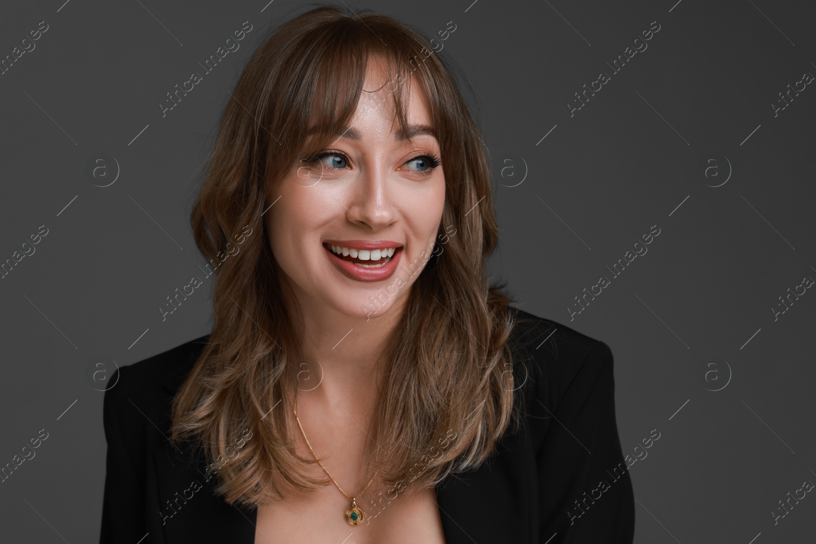 Photo of Attractive woman with stylish haircut on grey background