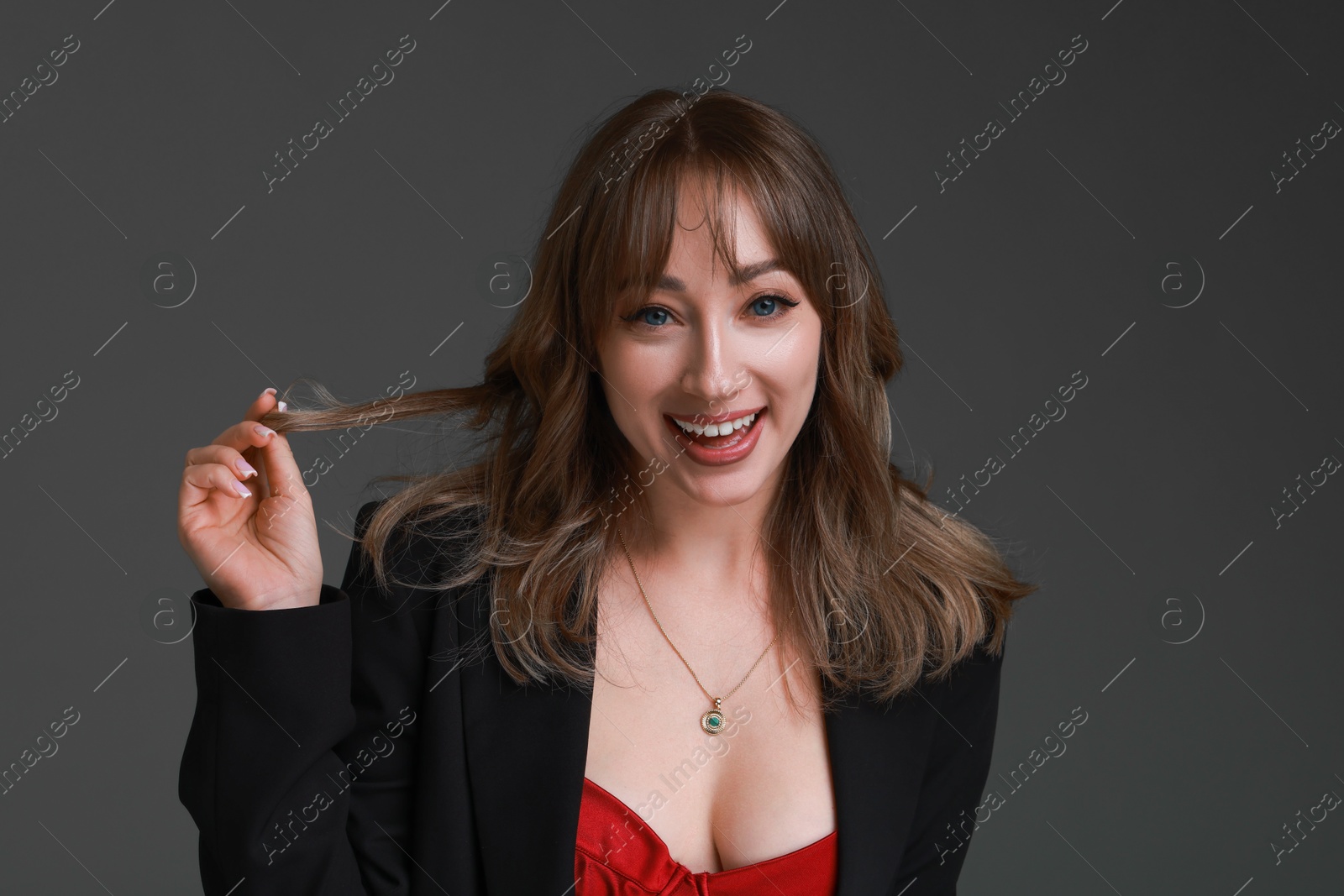 Photo of Attractive woman with stylish haircut on grey background