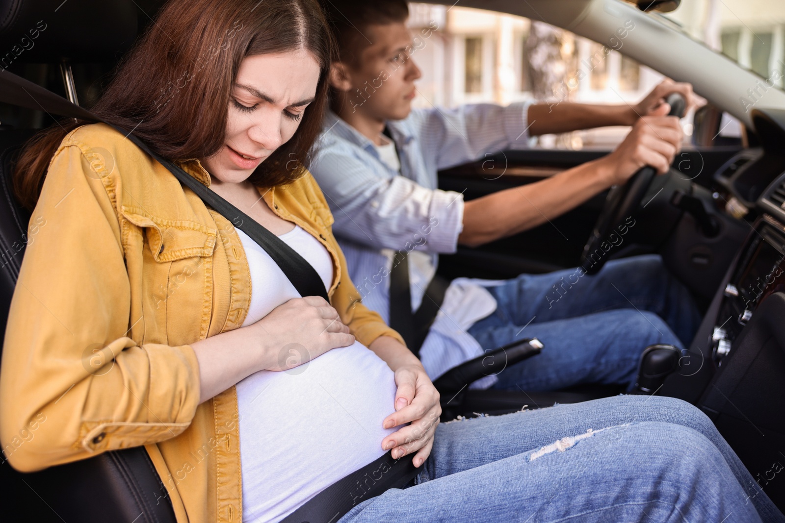 Photo of Pregnant woman travelling with her husband by car