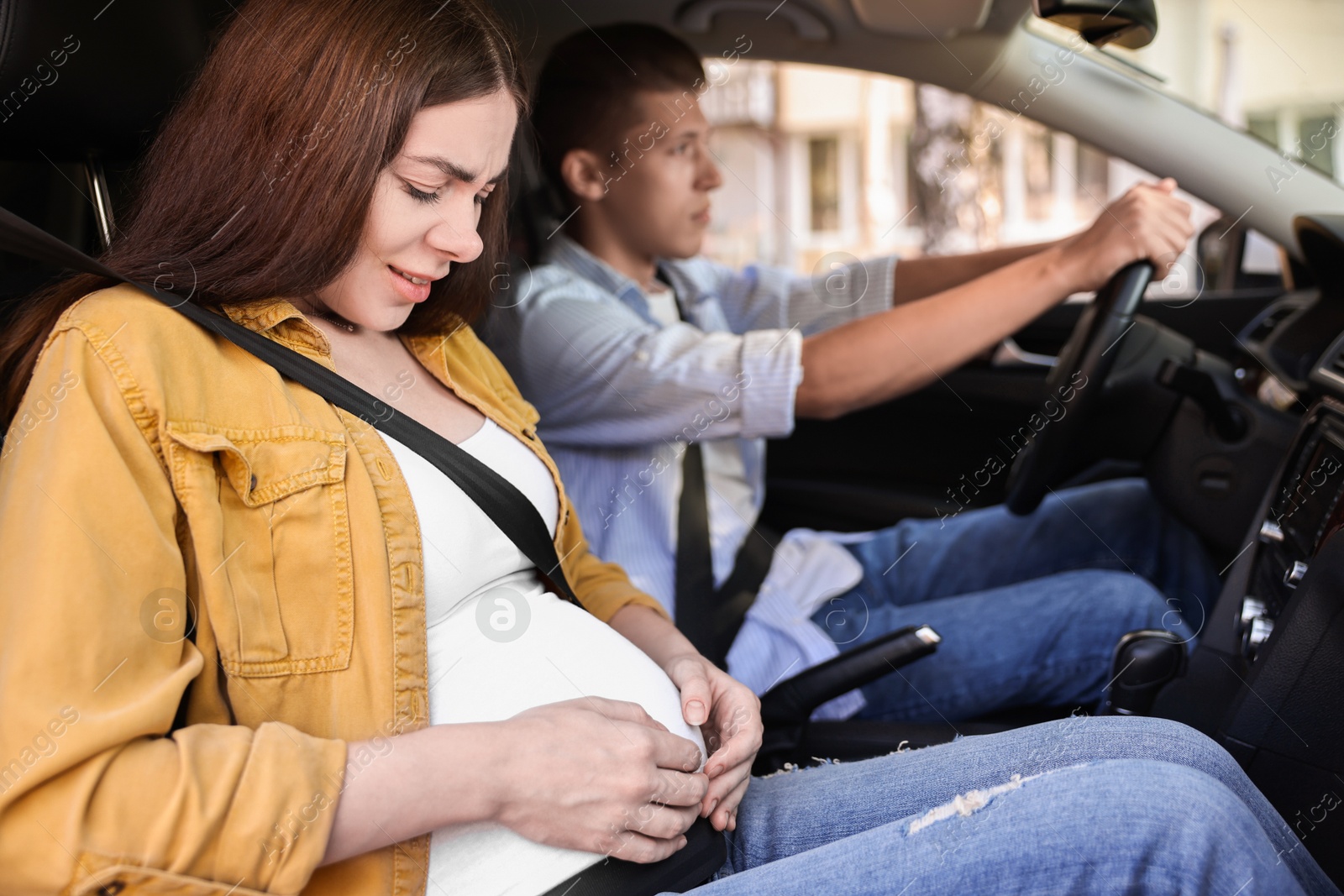 Photo of Pregnant woman travelling with her husband by car