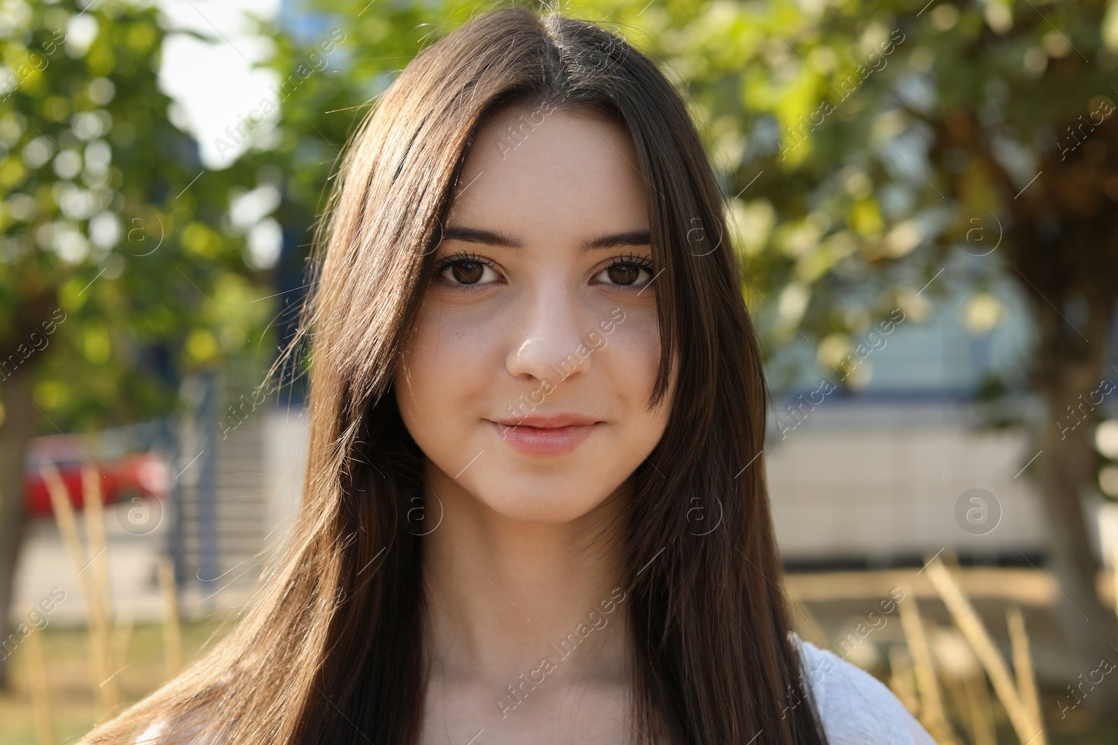 Photo of Portrait of beautiful teenage girl on city street