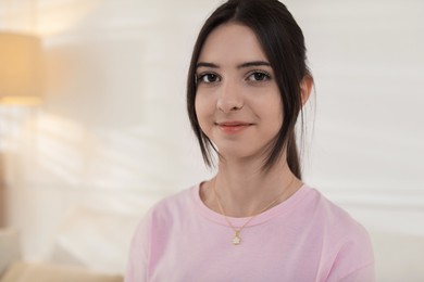 Photo of Portrait of beautiful teenage girl at home