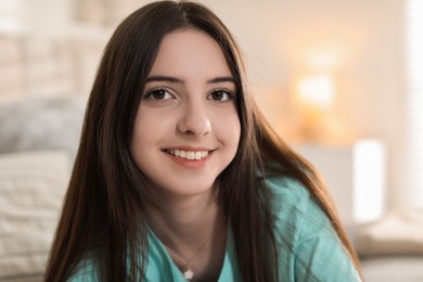 Photo of Portrait of happy teenage girl at home