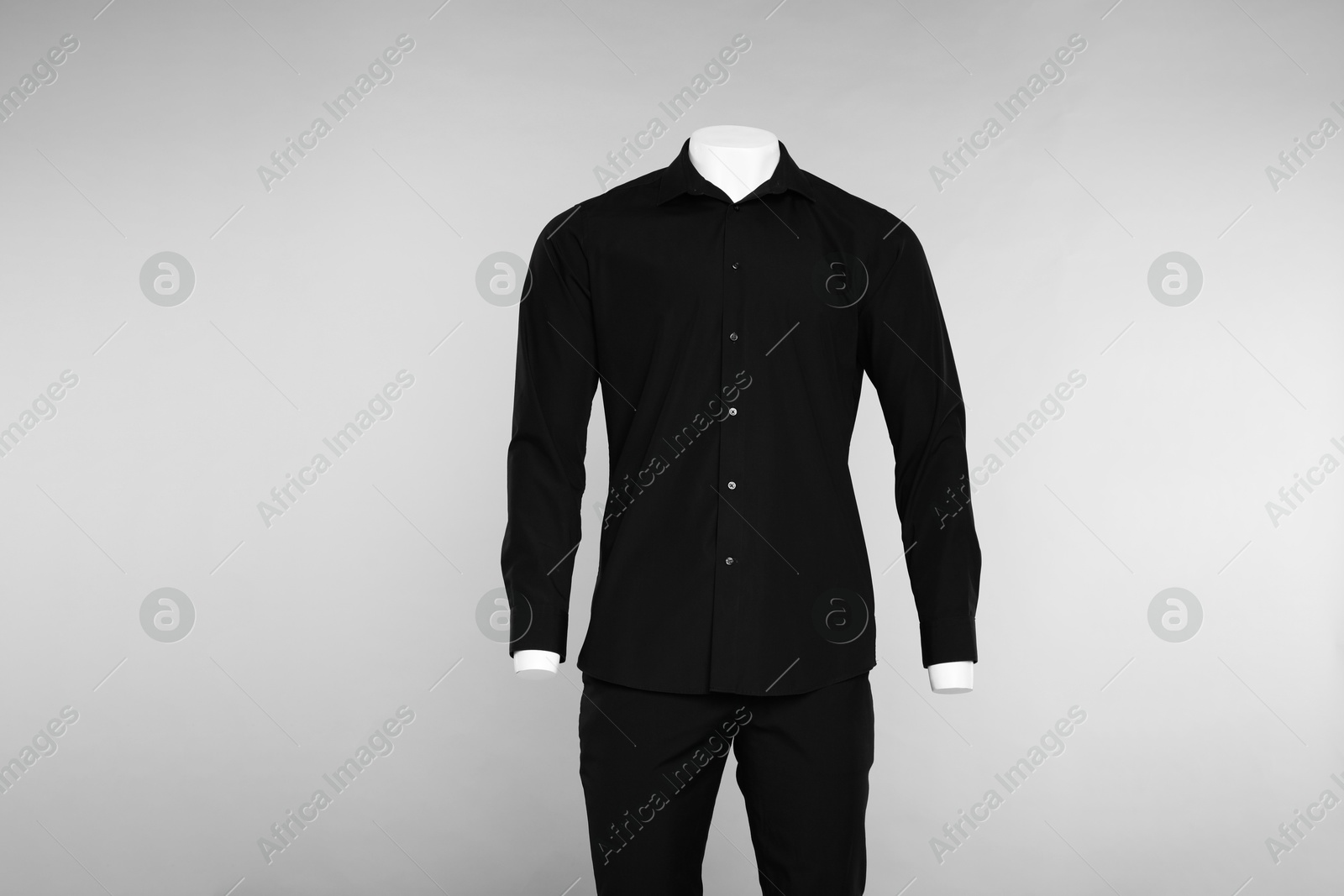 Photo of Male mannequin with stylish outfit on light grey background