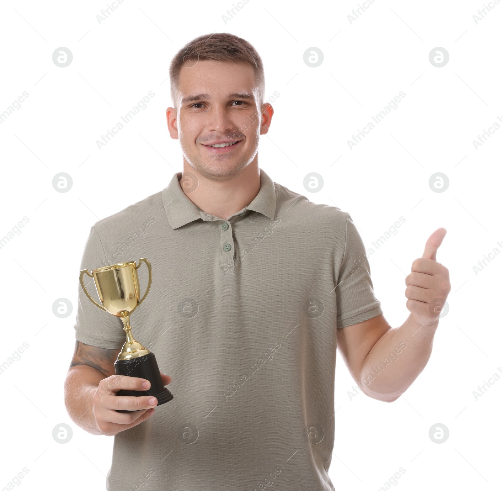 Photo of Happy winner with golden trophy cup showing thumbs up on white background