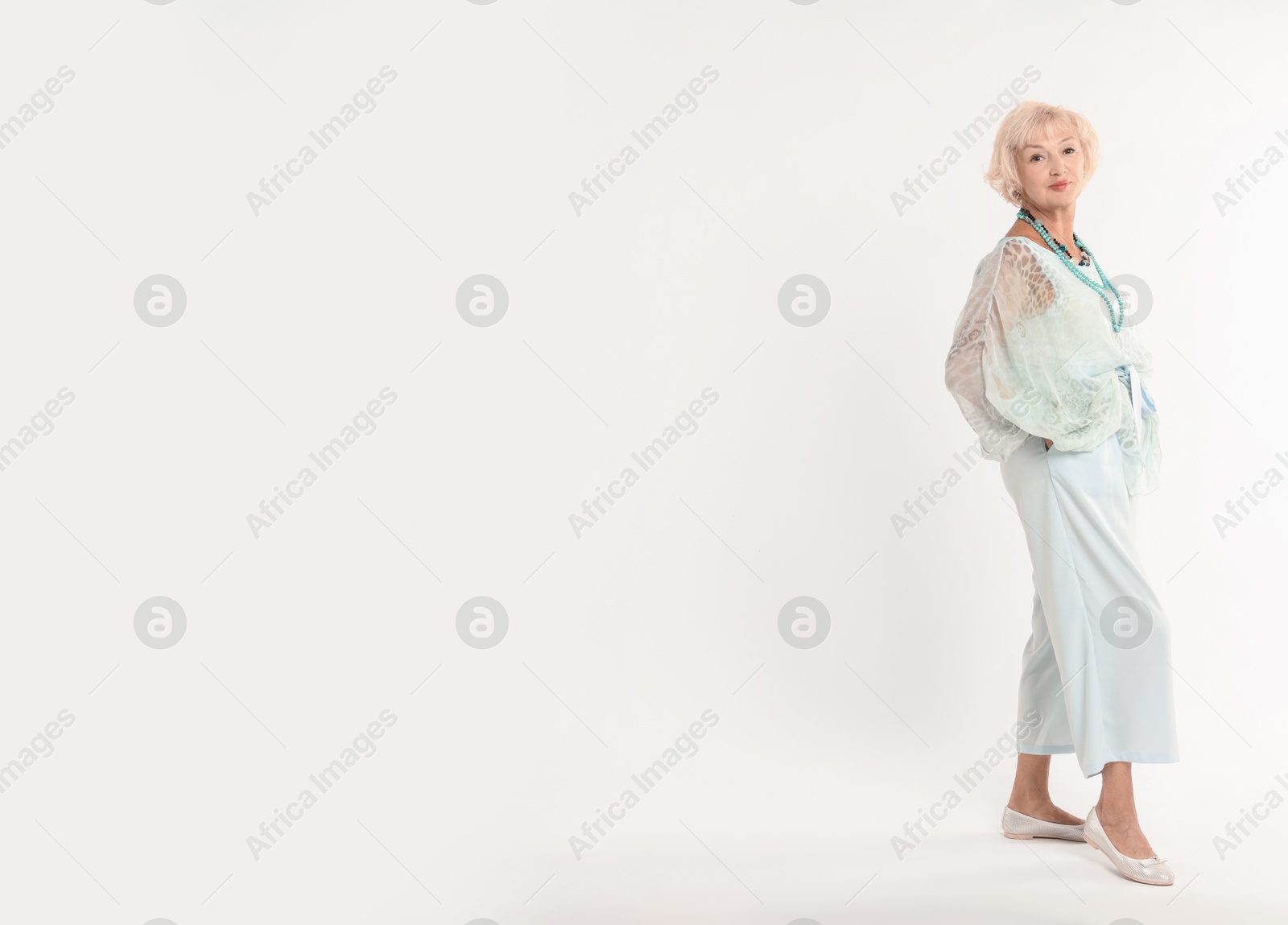 Photo of Full length portrait of beautiful senior woman on white background, space for text