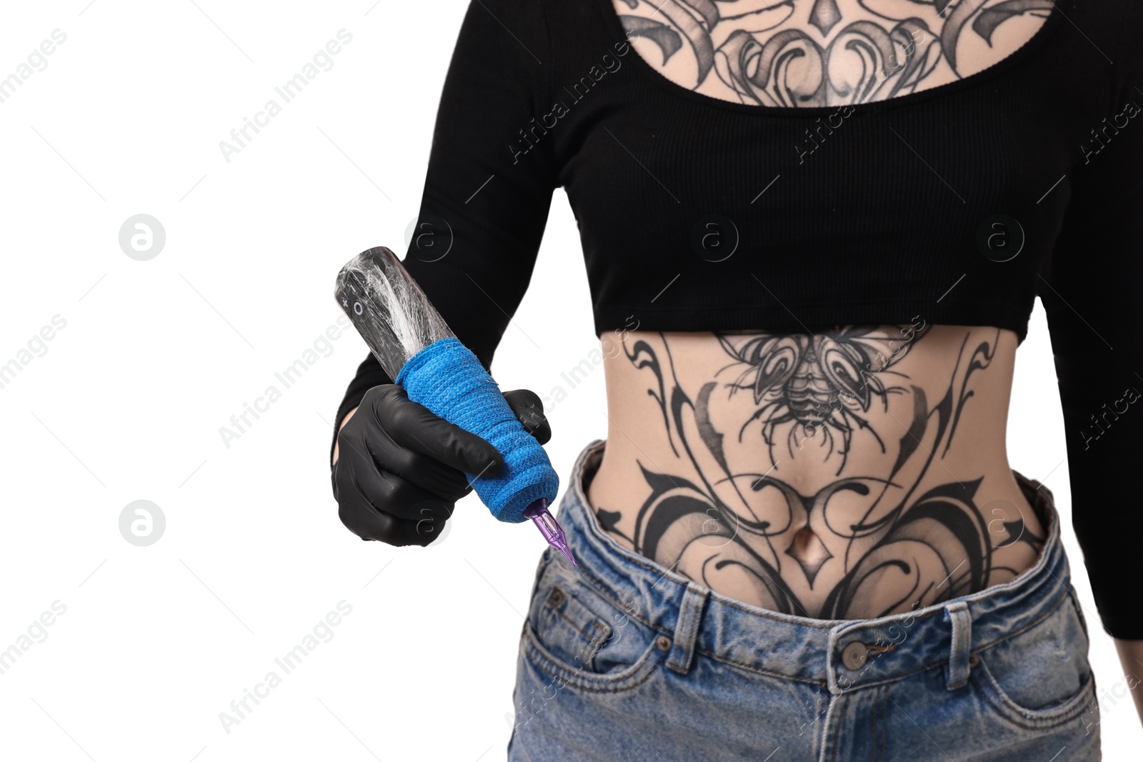 Photo of Professional artist in gloves holding tattoo machine on white background, closeup