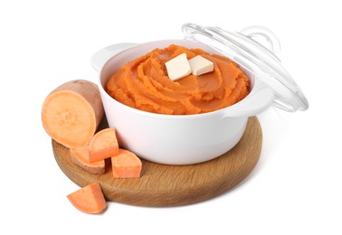 Photo of Tasty mashed sweet potato with butter in bowl and cut vegetable isolated on white