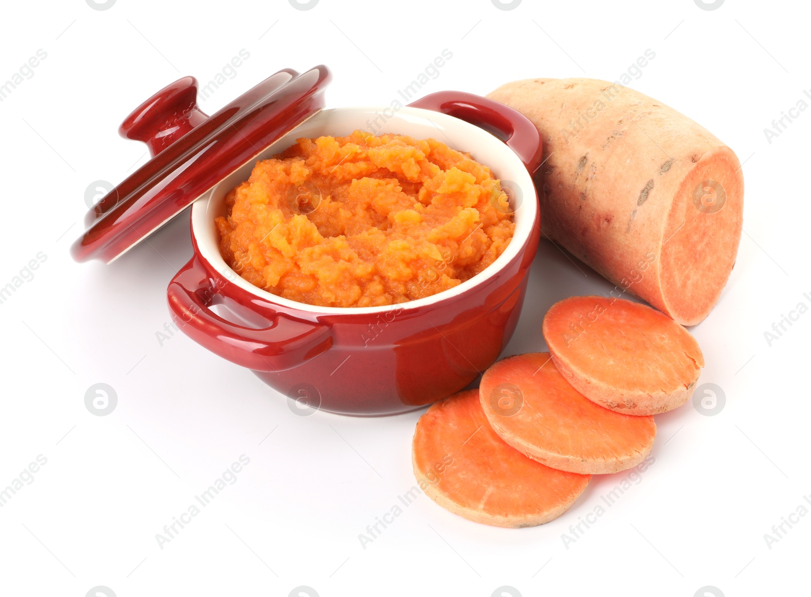 Photo of Tasty mashed sweet potato in pot and cut vegetable isolated on white