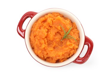 Photo of Tasty mashed sweet potato with rosemary in pot isolated on white, top view