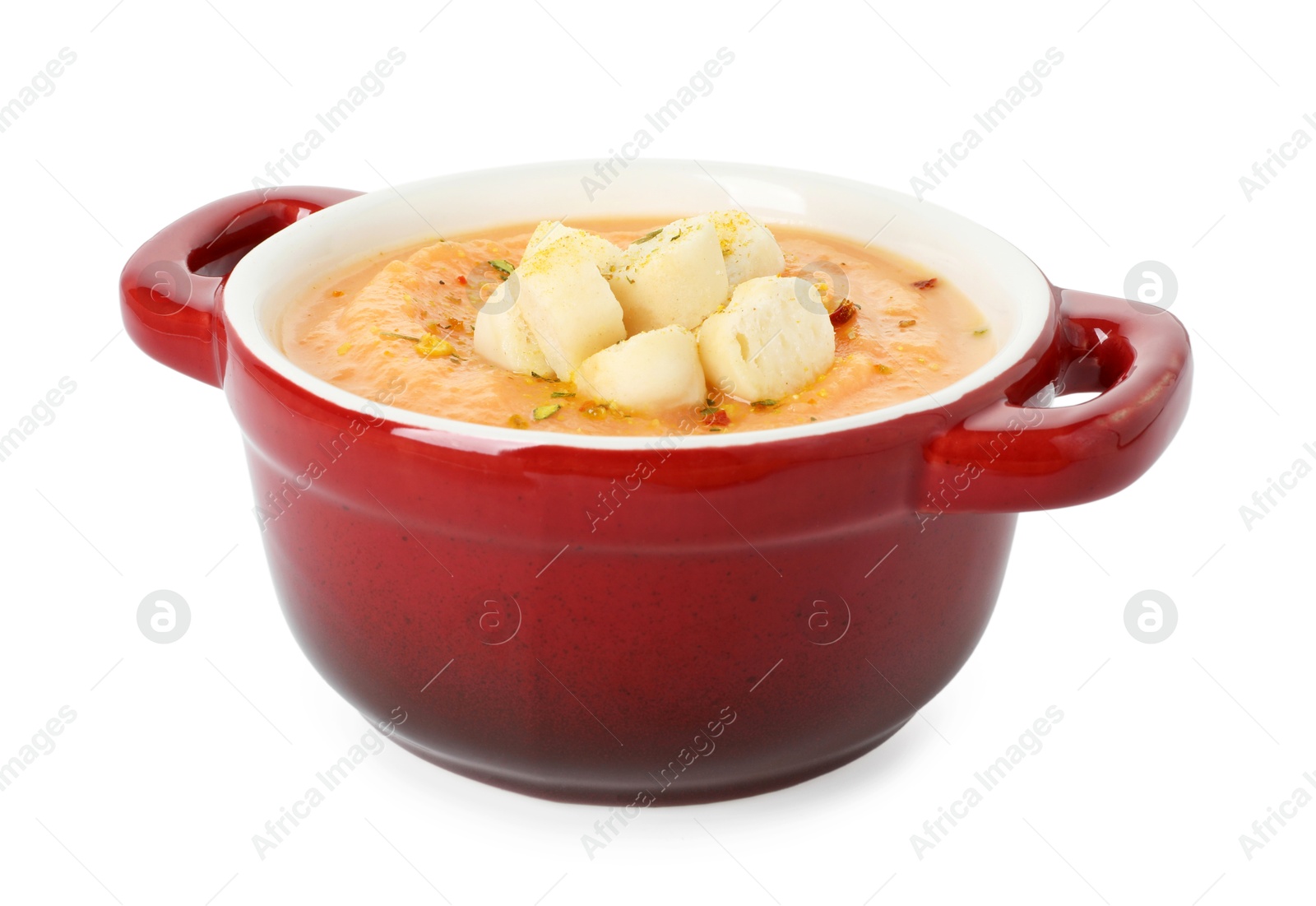 Photo of Delicious sweet potato soup with croutons isolated on white