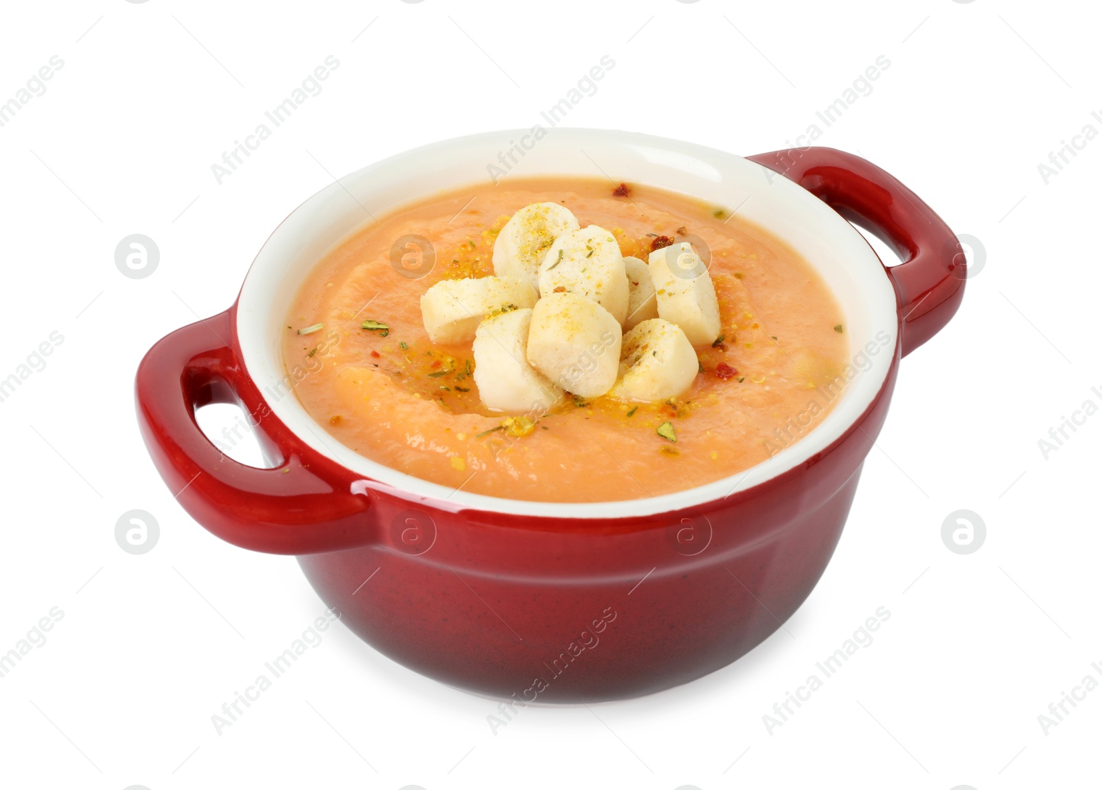 Photo of Delicious sweet potato soup with croutons isolated on white