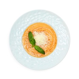 Photo of Delicious sweet potato soup with basil and parmesan cheese isolated on white, top view