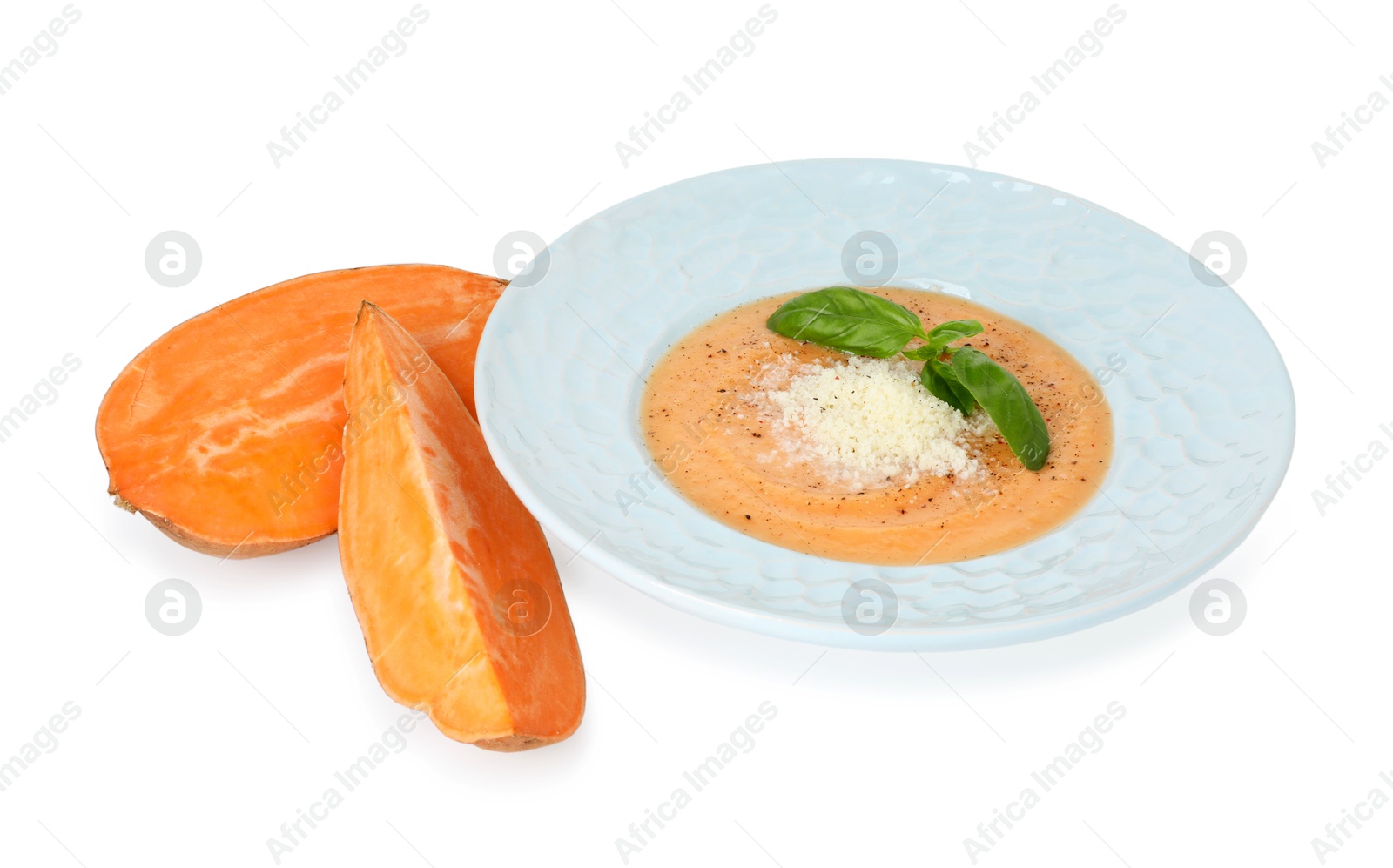 Photo of Delicious sweet potato soup with parmesan cheese and fresh vegetable isolated on white