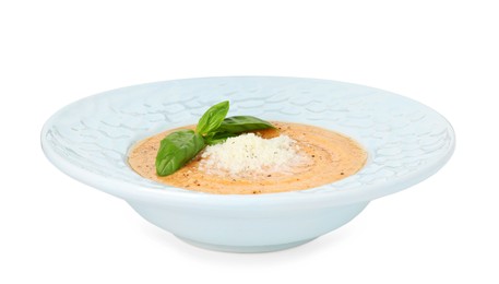 Photo of Delicious sweet potato soup with basil and parmesan cheese isolated on white