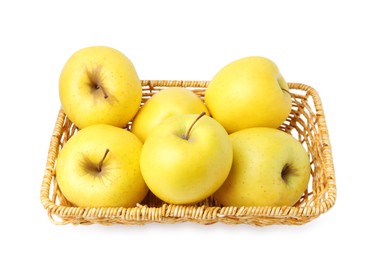 Many fresh yellow apples in wicker basket isolated on white