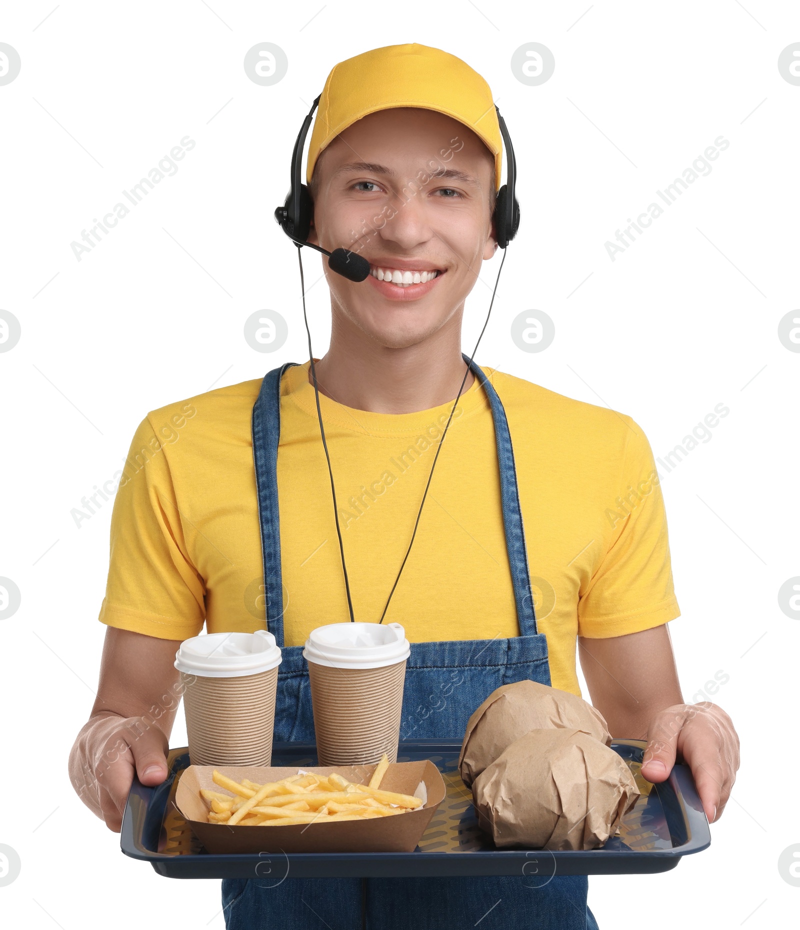 Photo of Fast-food worker holding tray with order on white background