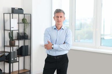 Photo of Portrait of middle aged man in office