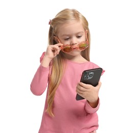 Photo of Cute little girl with smartphone on white background