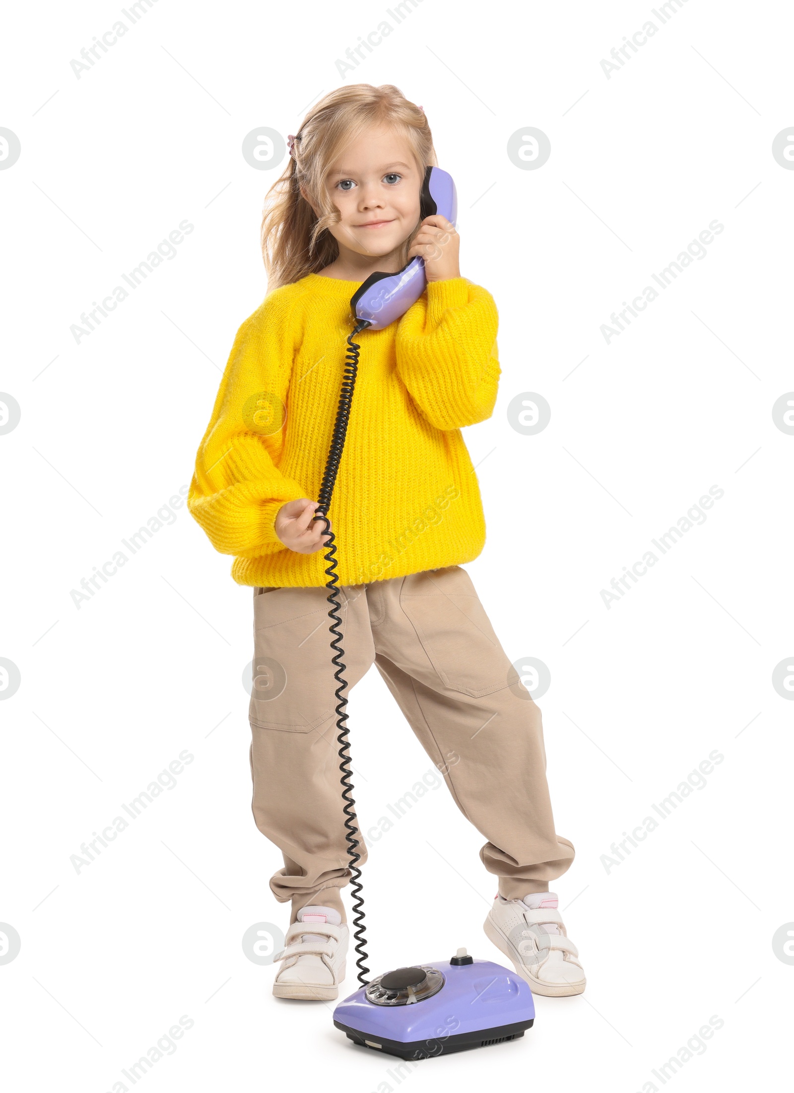 Photo of Cute little girl with telephone on white background