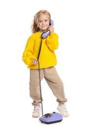 Photo of Cute little girl with telephone on white background