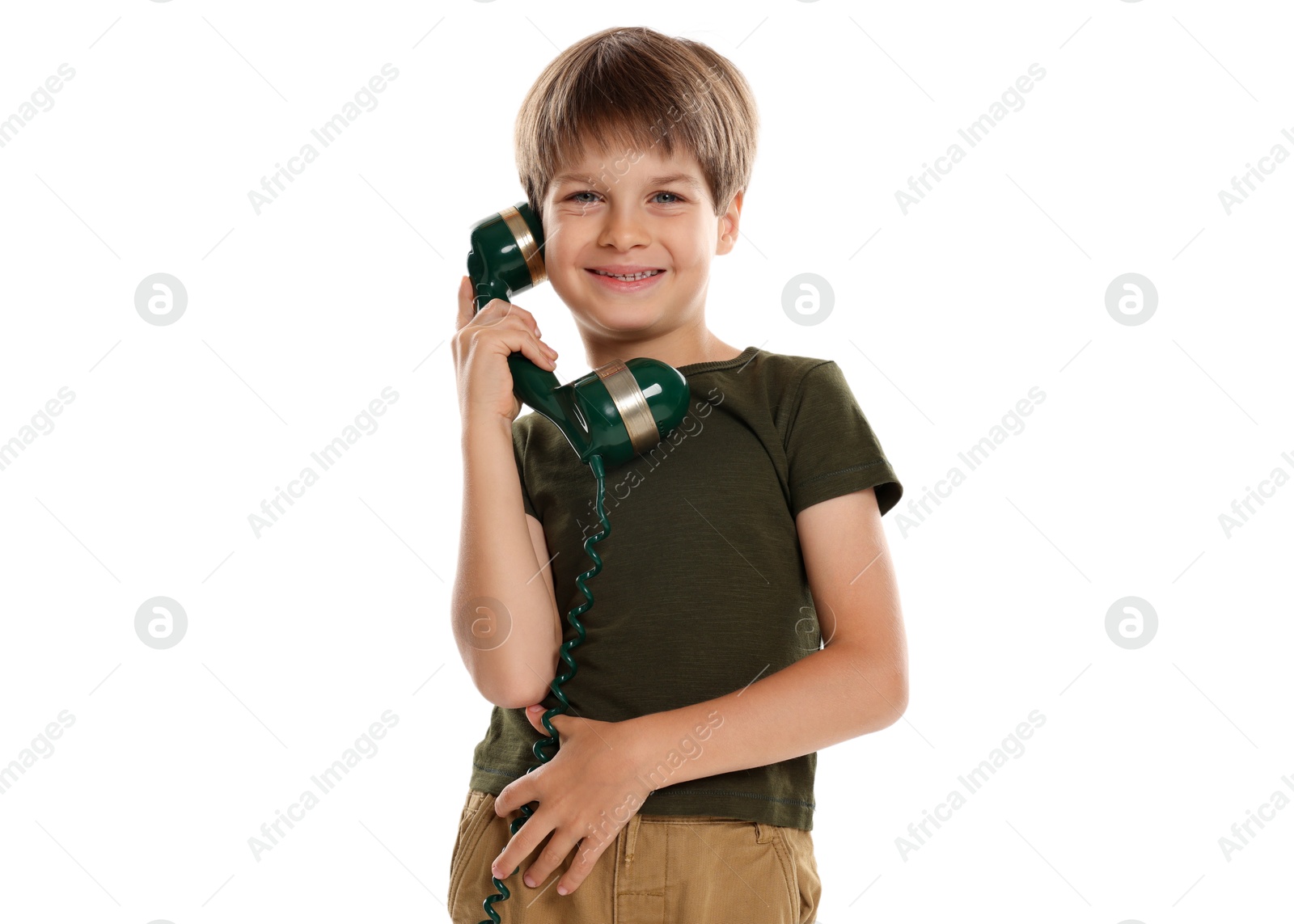 Photo of Cute little boy with handset of telephone on white background