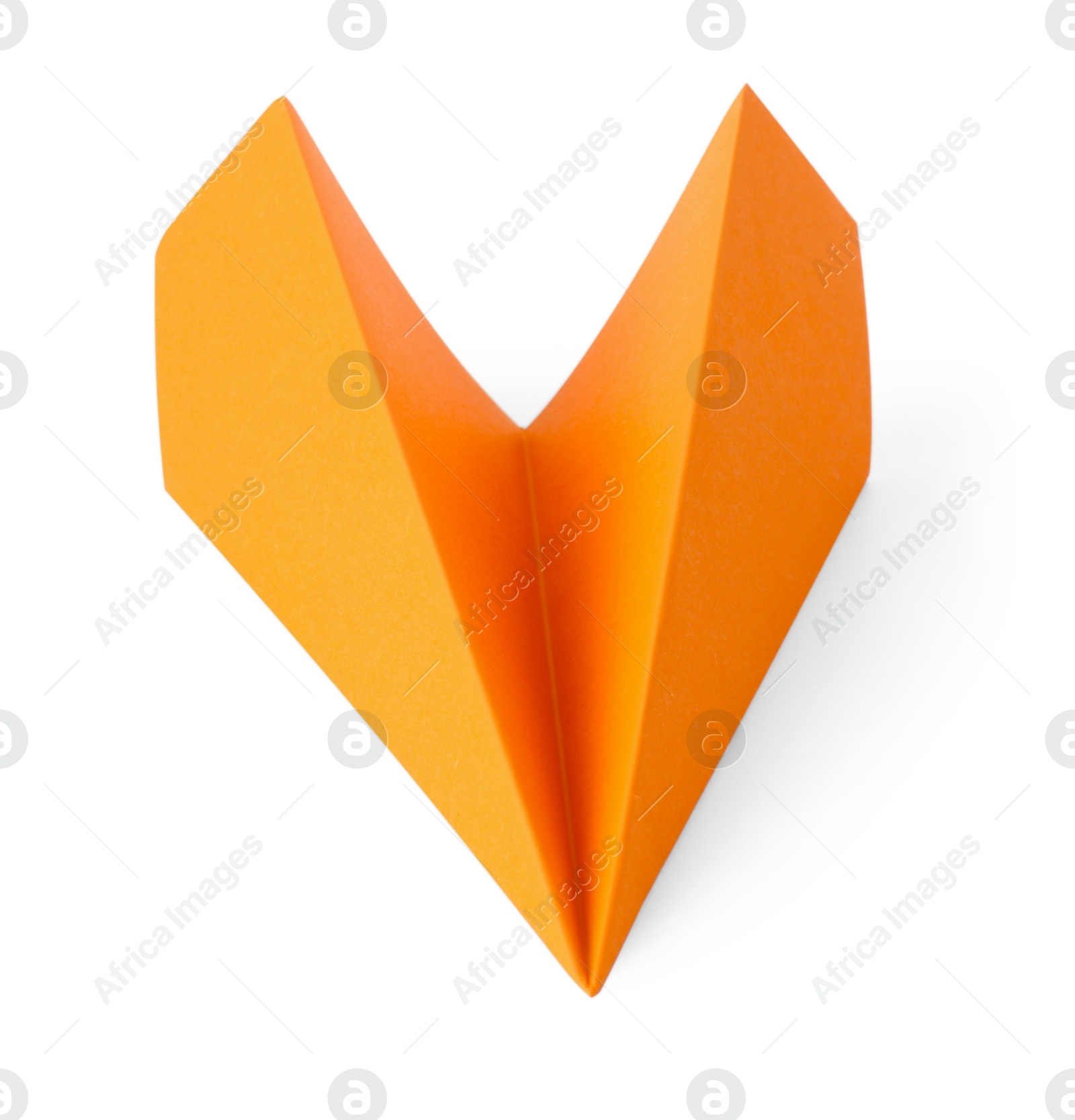 Photo of One handmade orange paper plane isolated on white