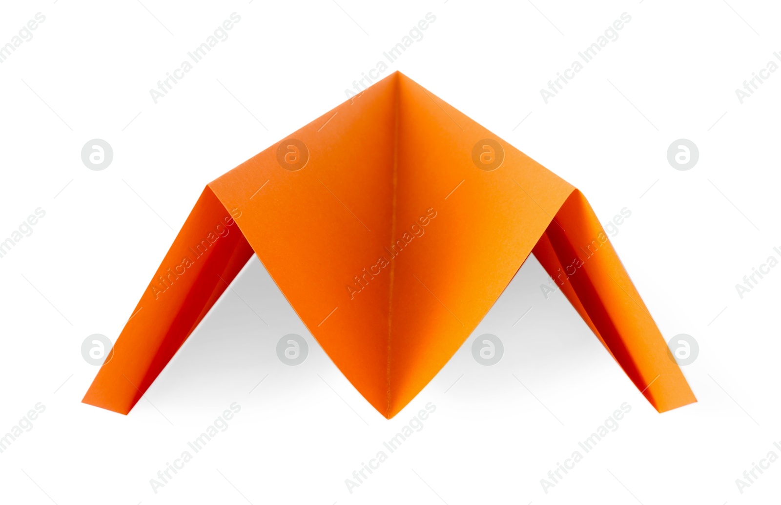 Photo of One handmade orange paper plane isolated on white