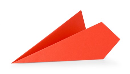 Photo of One handmade coral paper plane isolated on white