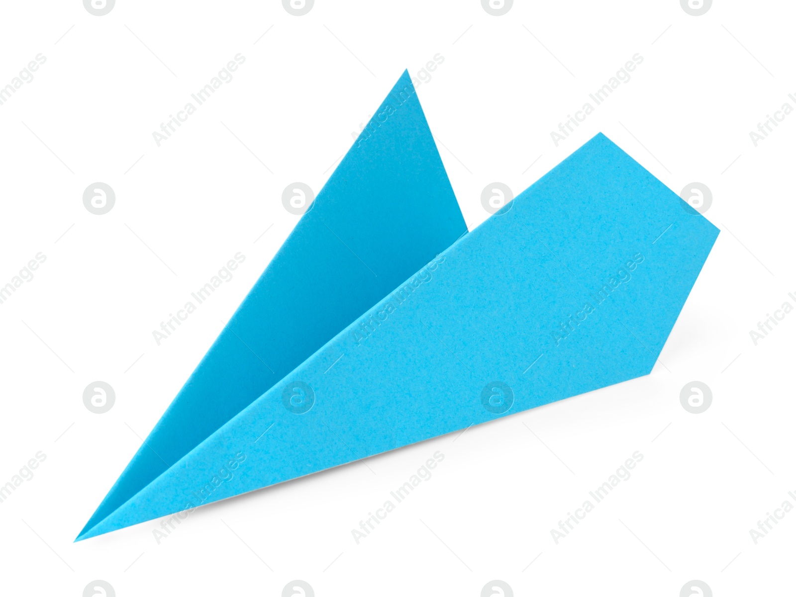 Photo of One handmade light blue paper plane isolated on white