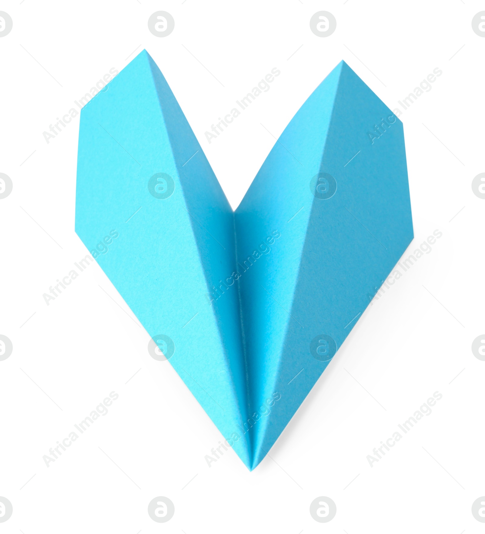 Photo of One handmade light blue paper plane isolated on white