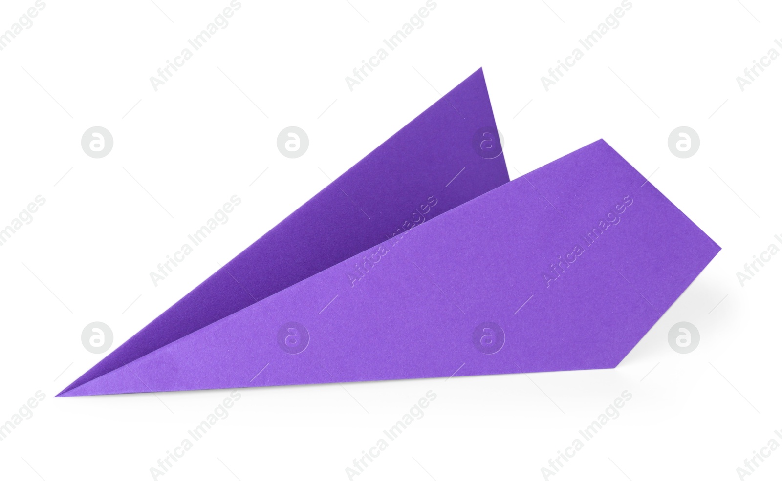 Photo of One handmade purple paper plane isolated on white