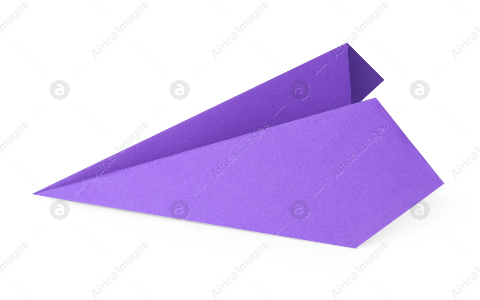 Photo of One handmade purple paper plane isolated on white