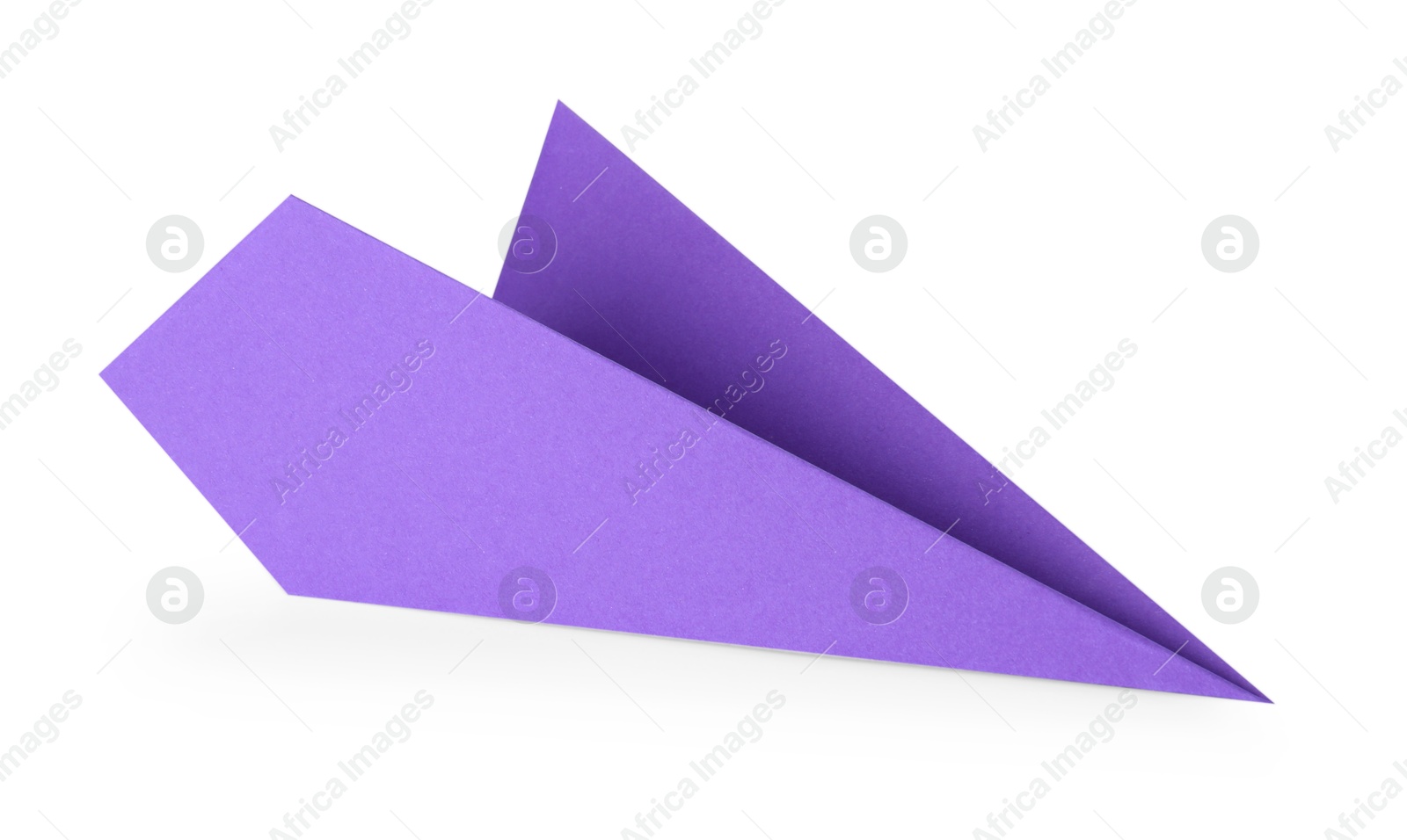 Photo of One handmade purple paper plane isolated on white