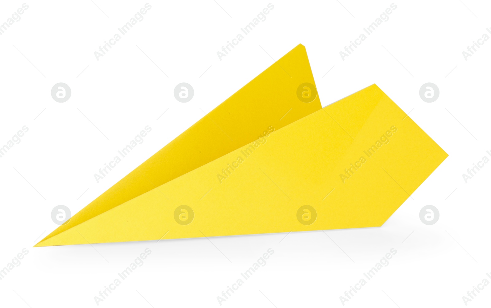 Photo of One handmade yellow paper plane isolated on white