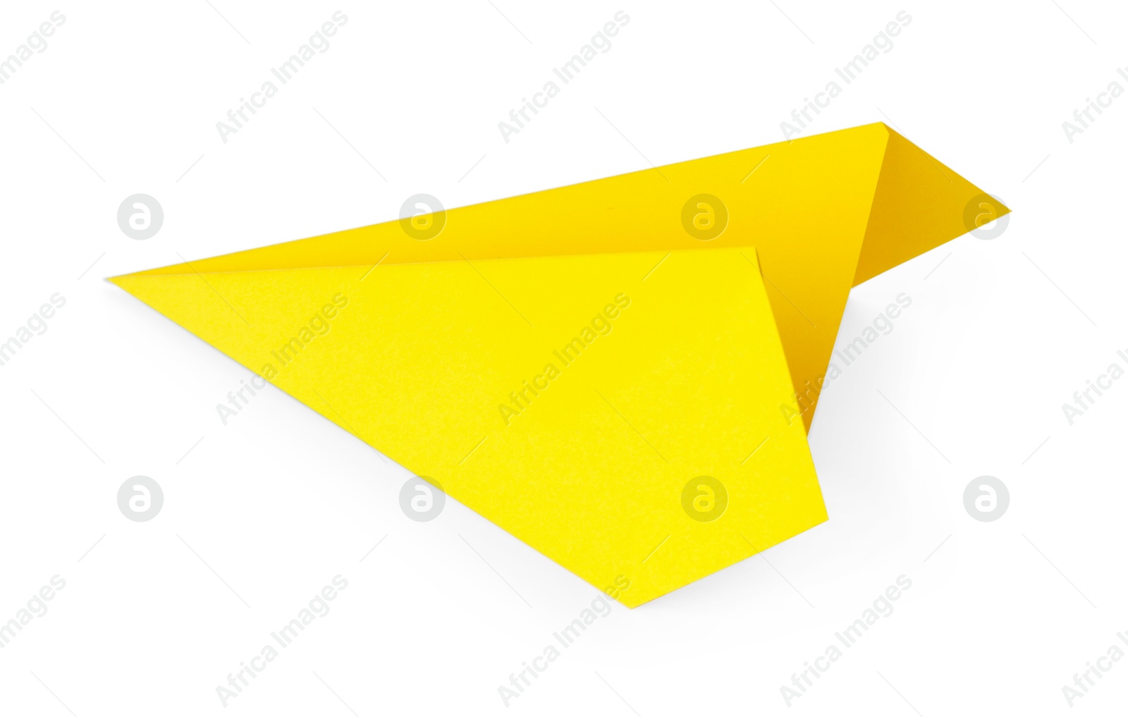 Photo of One handmade yellow paper plane isolated on white