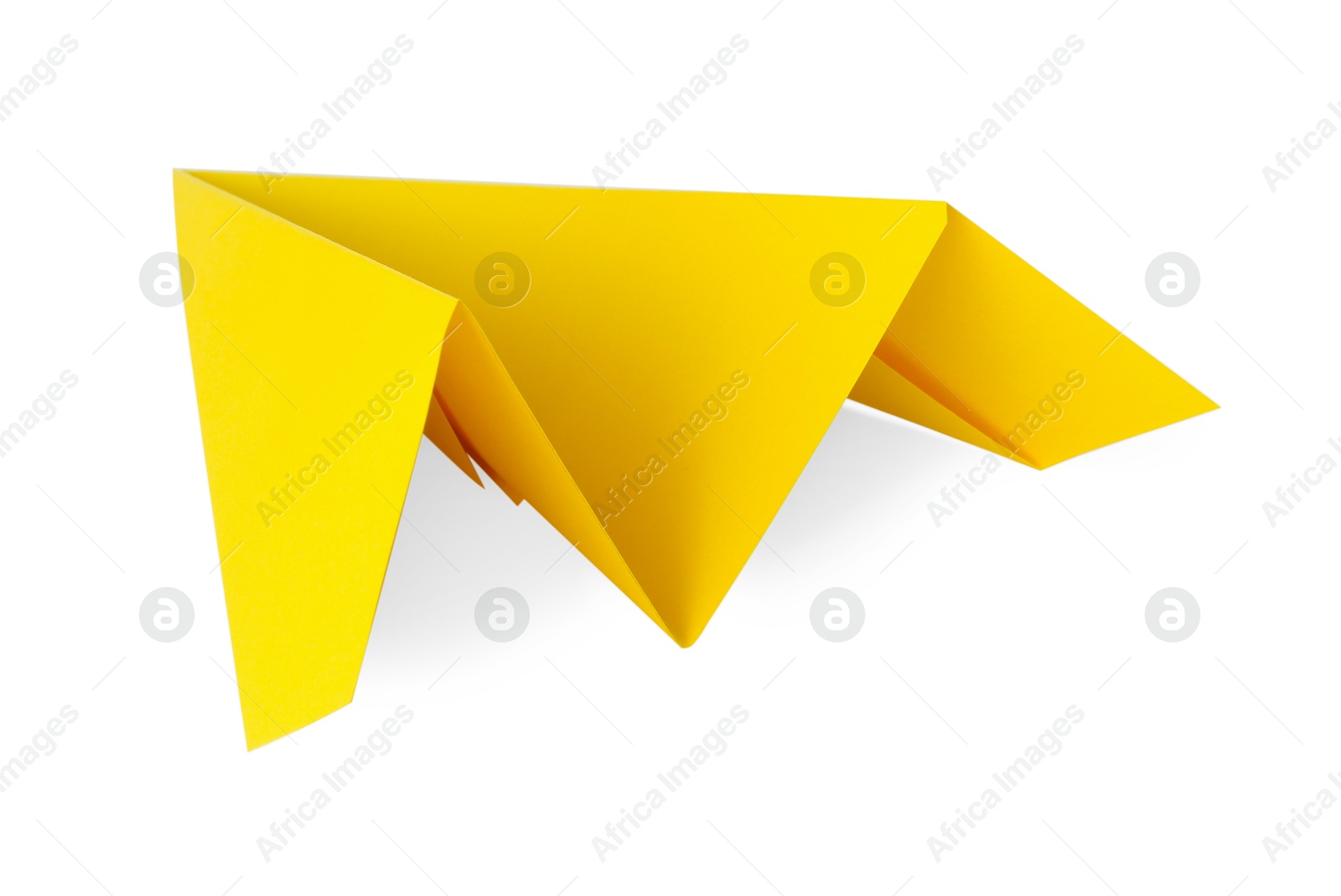 Photo of One handmade yellow paper plane isolated on white