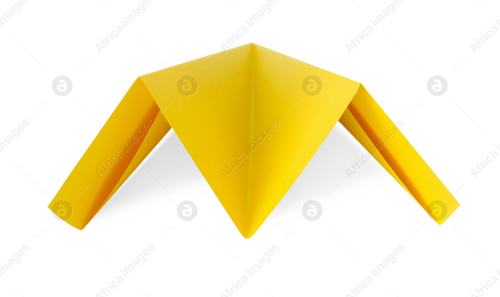 Photo of One handmade yellow paper plane isolated on white