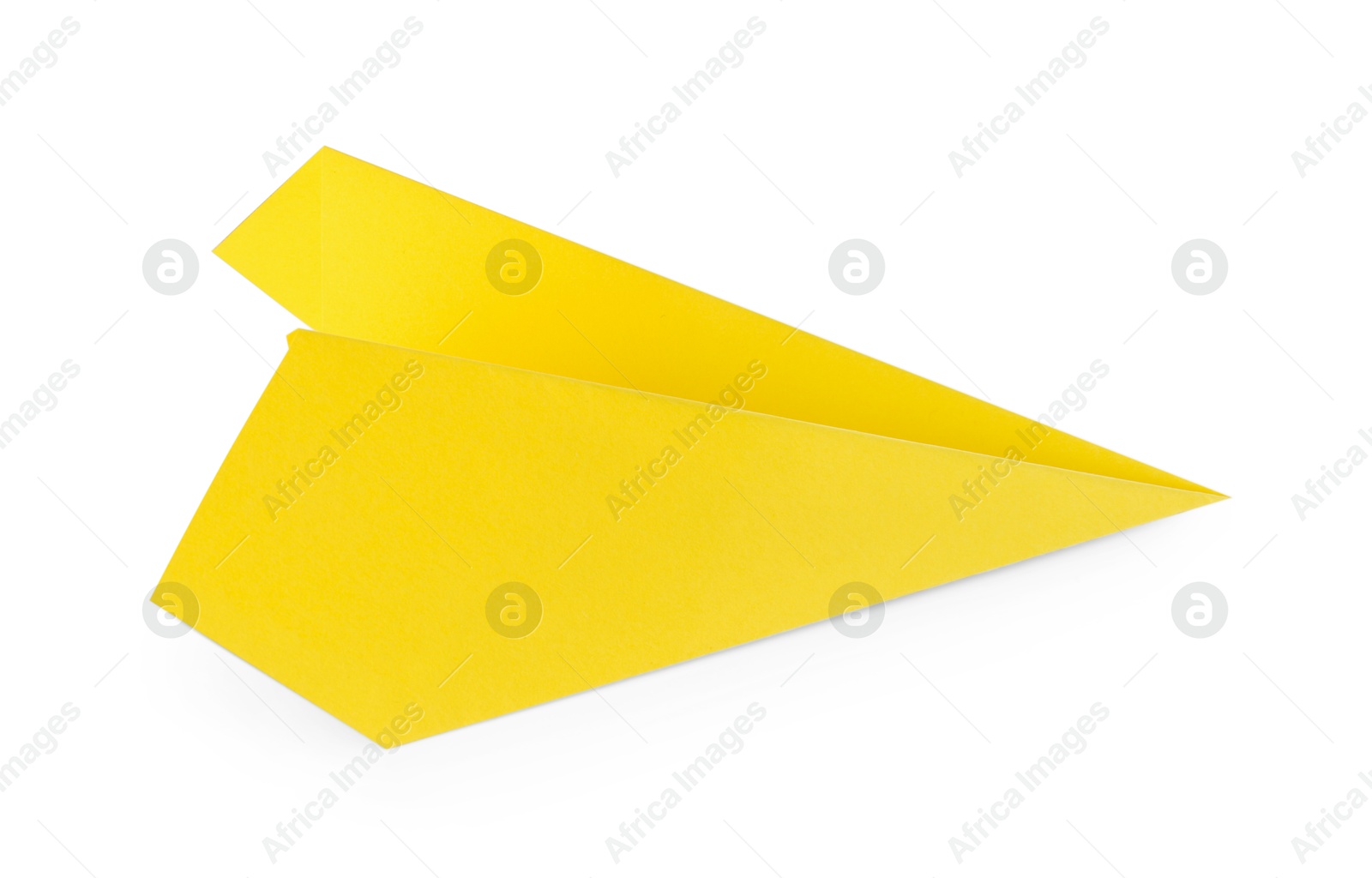 Photo of One handmade yellow paper plane isolated on white