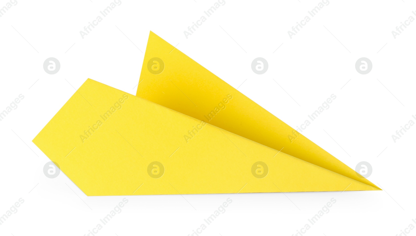 Photo of One handmade yellow paper plane isolated on white