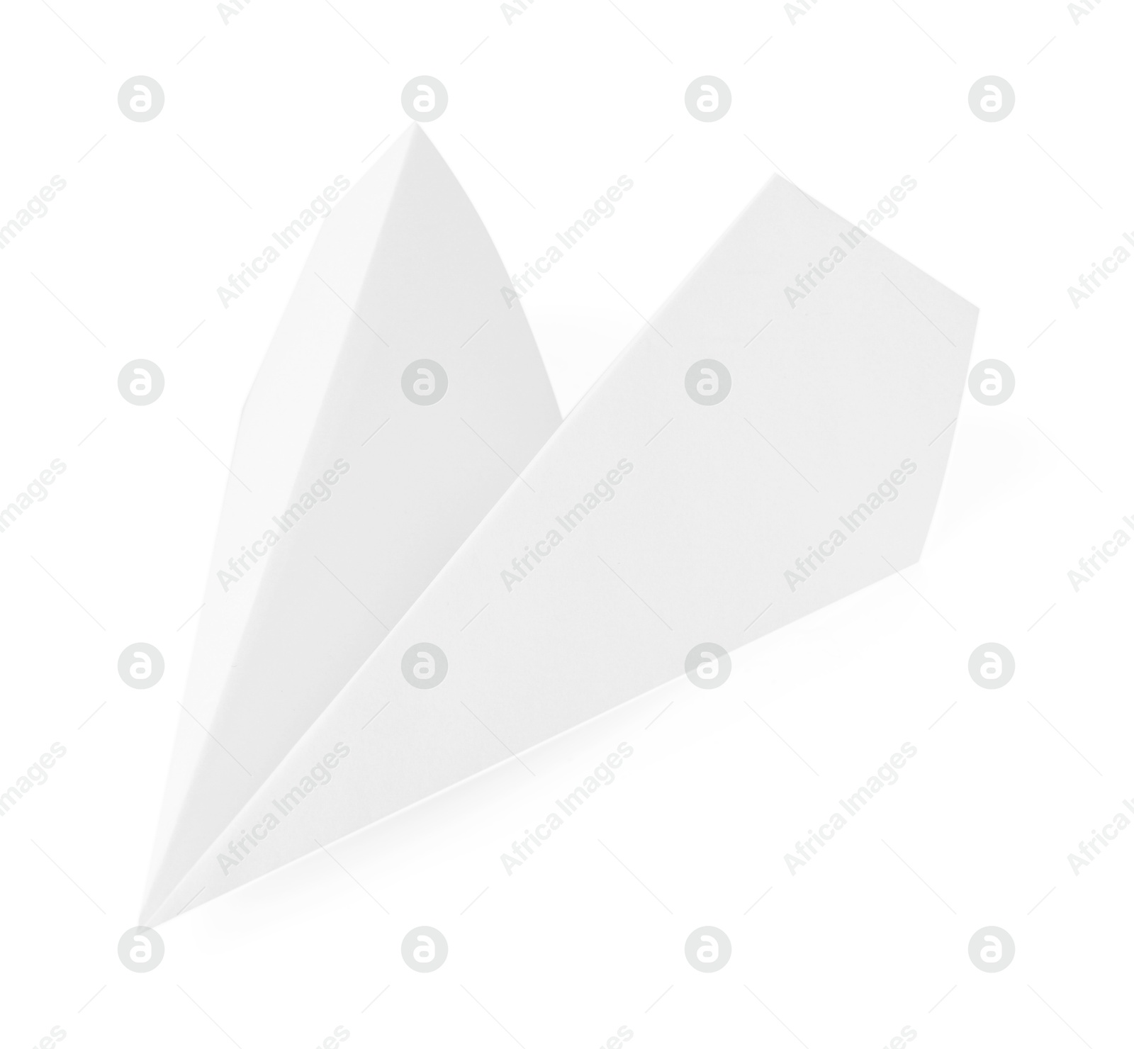 Photo of One handmade paper plane isolated on white