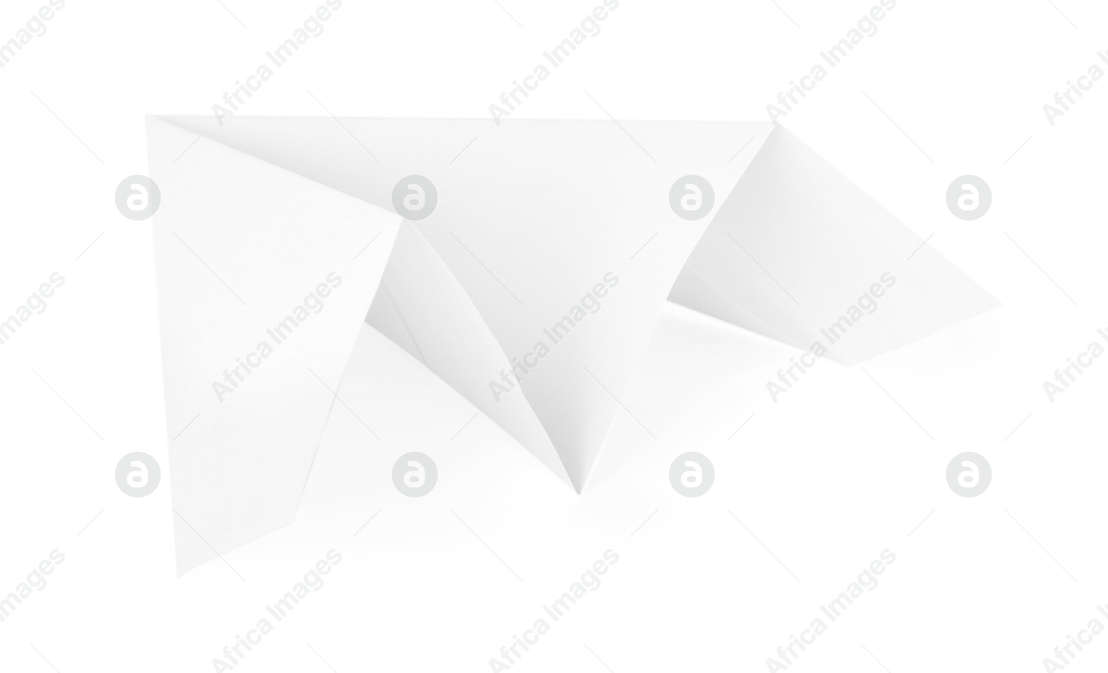 Photo of One handmade paper plane isolated on white