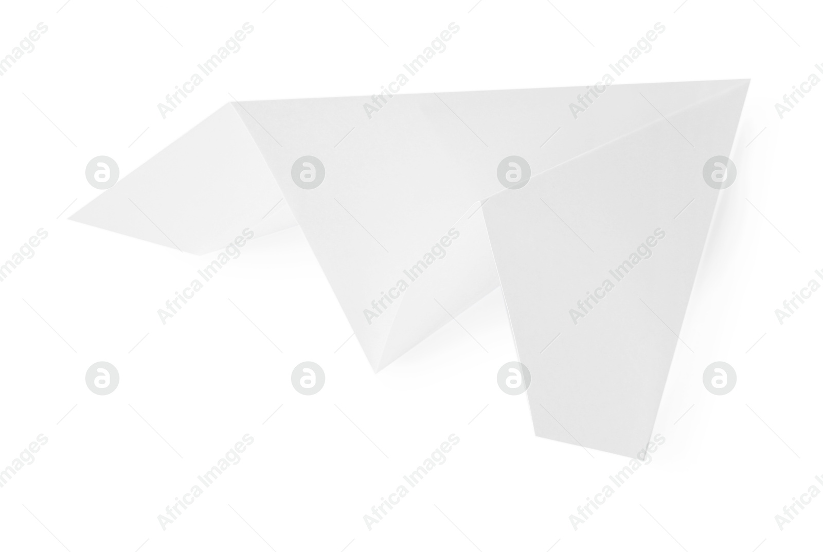 Photo of One handmade paper plane isolated on white