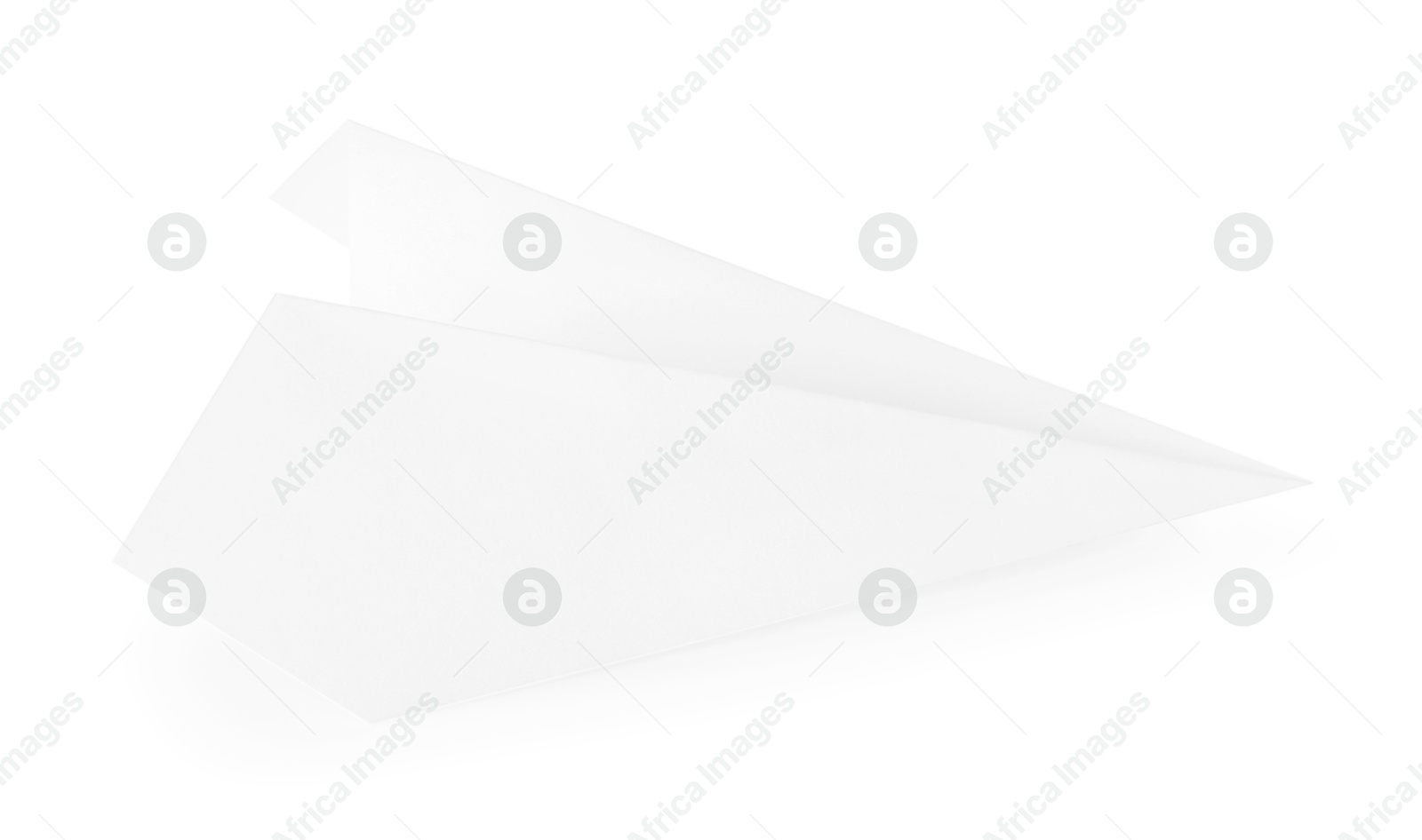 Photo of One handmade paper plane isolated on white