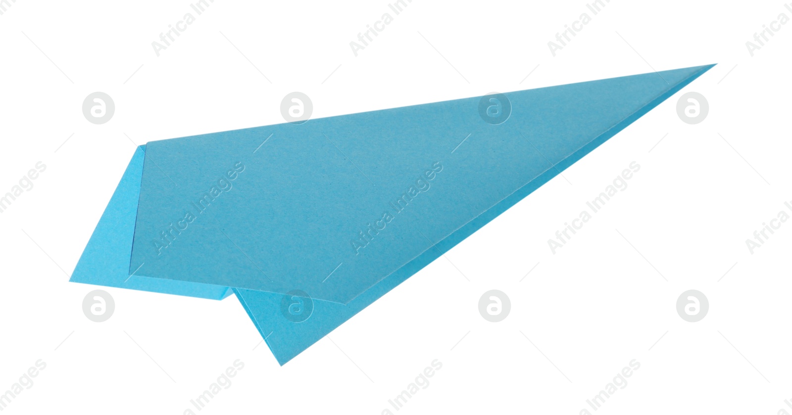 Photo of One handmade light blue paper plane isolated on white